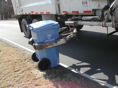 Trash Truck Picking up Can